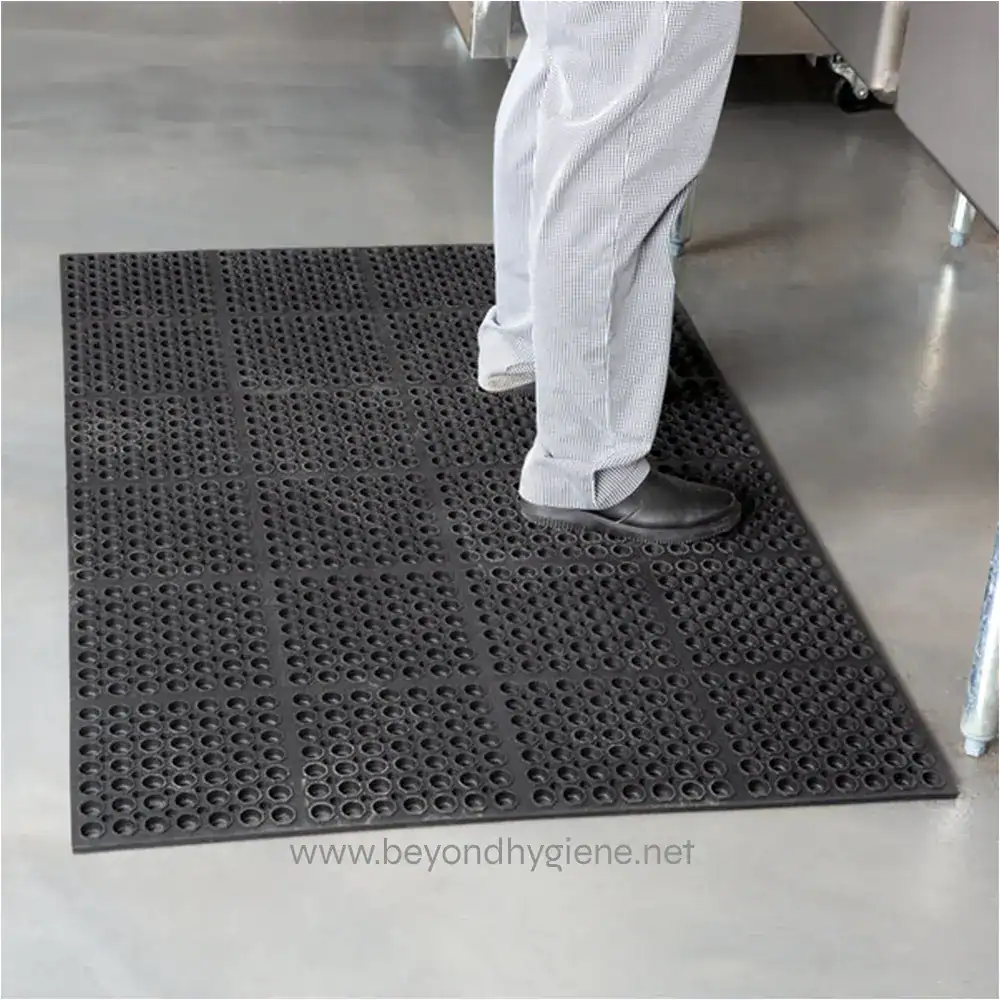 1765865 Non-slip black rubber mat for hygiene and safety, ideal for commercial kitchens and industrial environments, providing superior grip and ease of cleaning.