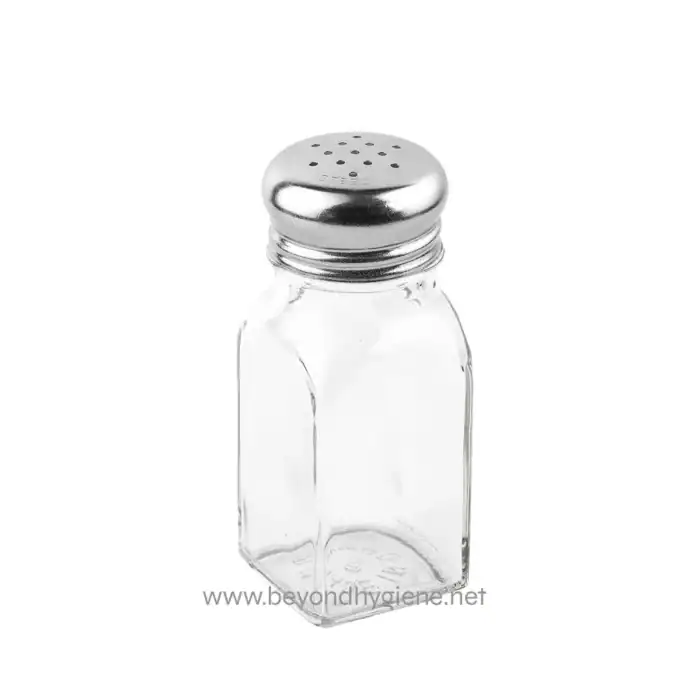 Stainless steel salt shaker on a plain white background for hygiene and sanitation.