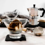 Delicious ice cream sundae with chocolate sauce served in a glass bowl, perfect for dessert, highlighting hygiene and cleanliness from Beyond Hygiene Asia.