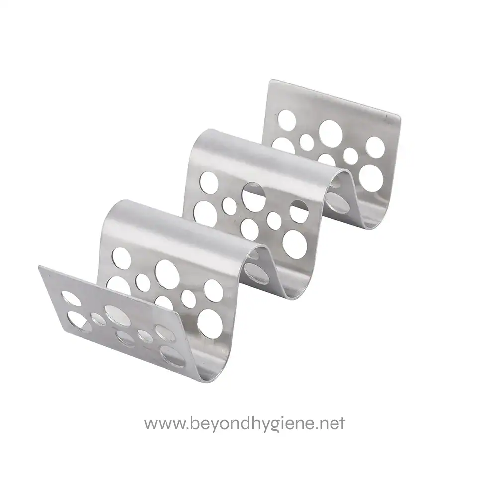 4 Stainless steel surgical instrument holder with multiple perforations, used for organizing medical tools in healthcare settings.