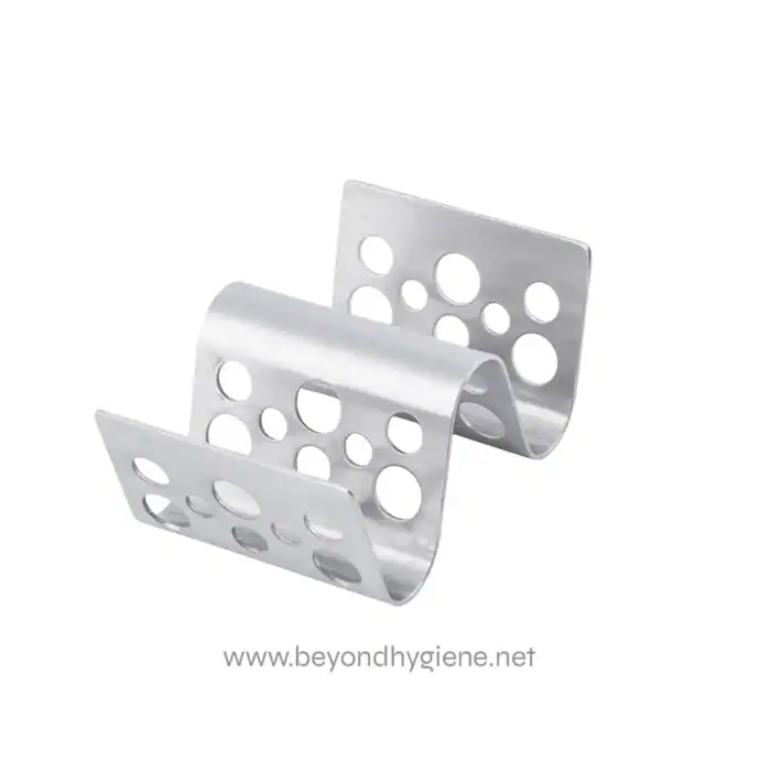 Stainless steel corner guard with perforated design for impact protection and wall preservation in commercial and industrial cleaning environments.