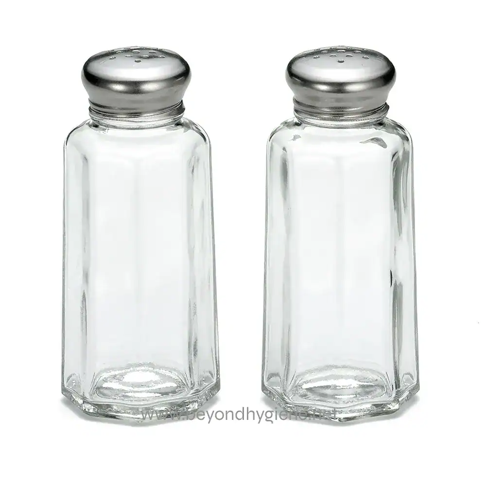 4 Salt and pepper shakers made of clear glass with silver caps, ideal for table settings and food service. Perfect for restaurants and households looking for durable, stylish condiment dispensers.