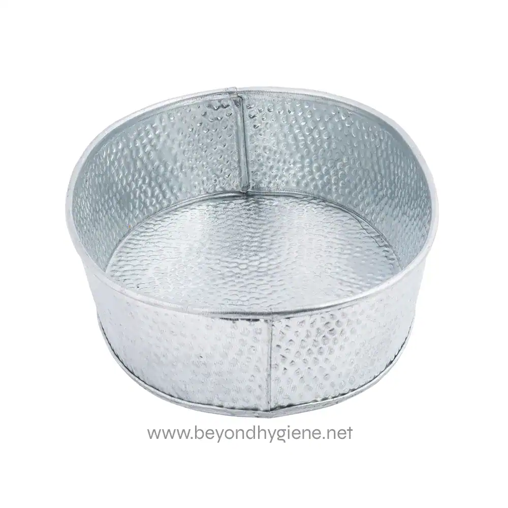 5 Stainless steel round soap dish with textured surface, ideal for hygiene and sanitation in commercial and healthcare settings. Durable and easy to clean.