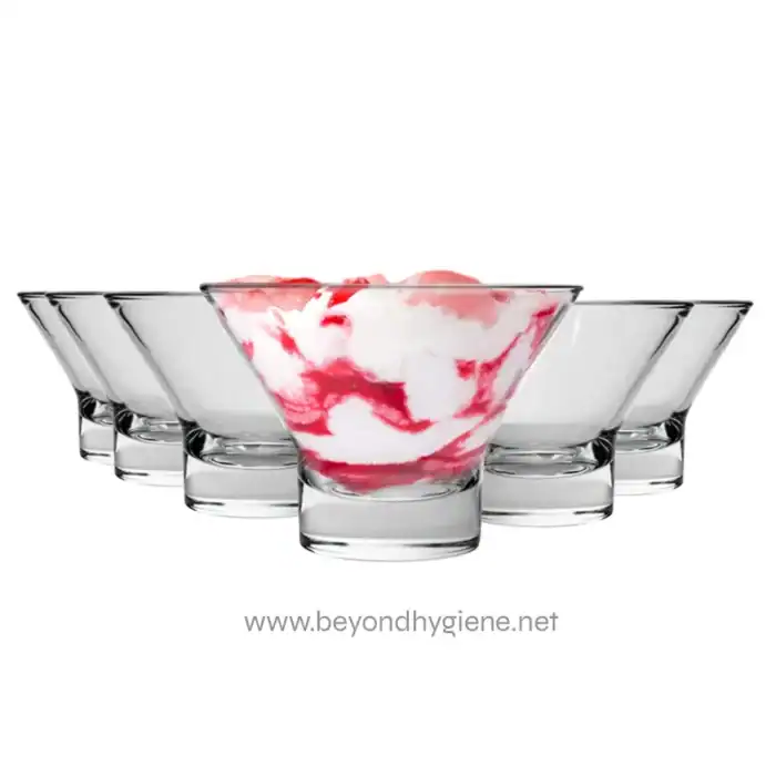Smooth glass bowls with pink and white ice cream, empty bowls around, clean and elegant dessert presentation, beyond hygiene asia, food service, ice cream display, sanitation standards, hygiene solutions.