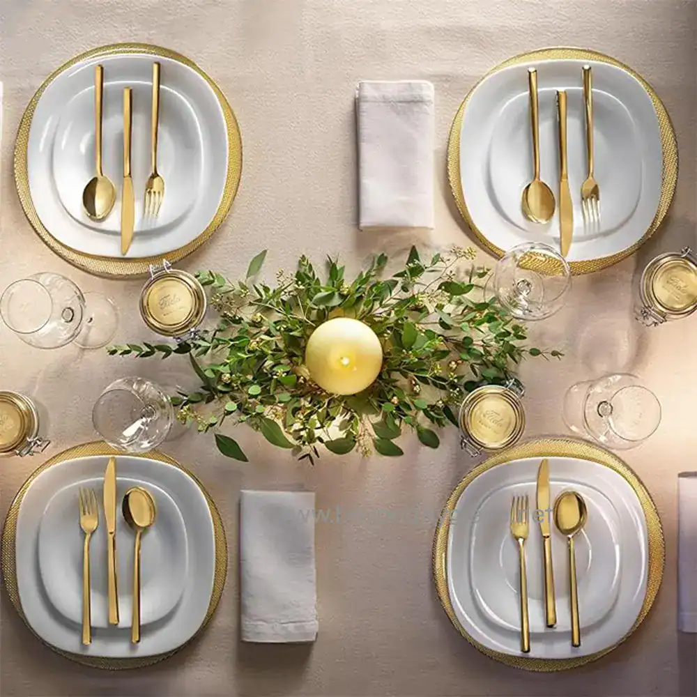 5 Luxurious table setting with white plates, gold cutlery, wine glasses, and elegant napkins, perfect for high-end dining events and catering services in Southeast Asia.