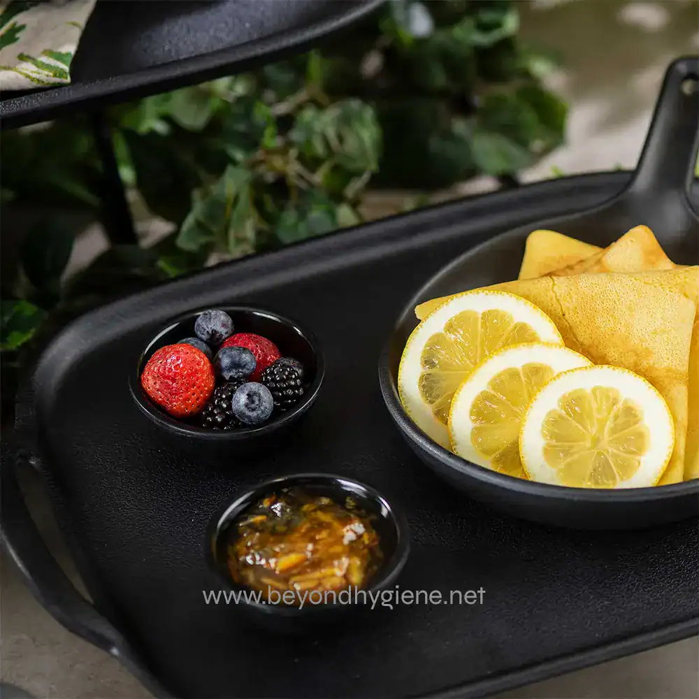 6 Fresh lemon slices and berries served on a tray, highlighting food and catering services for hygiene and cleanliness.