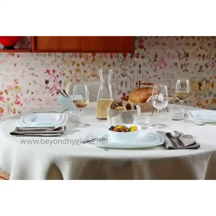 Luxury dining table setup with wine glasses, bread, and salad, showcasing hygiene and cleanliness standards at Beyond Hygiene Asia for foodservice sanitation and hospitality excellence.