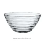 Clear glass salad bowl with a modern spiral design, ideal for dining and presentation. Perfect for salads, fruits, or serving dishes, combining elegance and functionality for Asian and international cuisine settings.