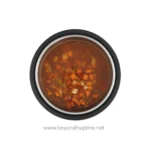 Steamed or boiled food in a stainless steel container, prepared for hygiene and sanitation. Ideal for food safety in healthcare, hospitality, or catering environments.