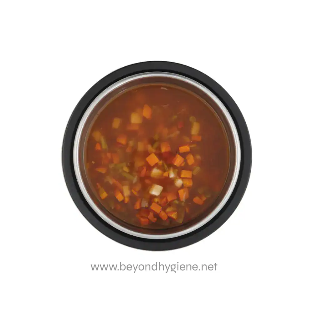 74110240_03 Steamed or boiled food in a stainless steel container, prepared for hygiene and sanitation. Ideal for food safety in healthcare, hospitality, or catering environments.