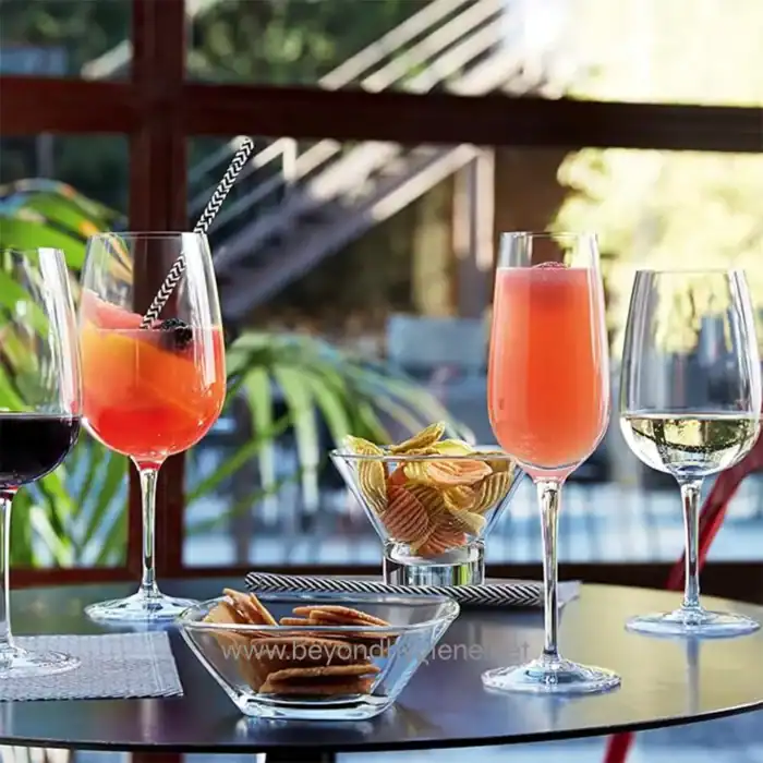 Refreshing beverages on a patio table with snacks, showcasing hygiene and cleanliness in Asia. Perfect for social gatherings, emphasizing hygiene standards at Beyond Hygiene Asia.