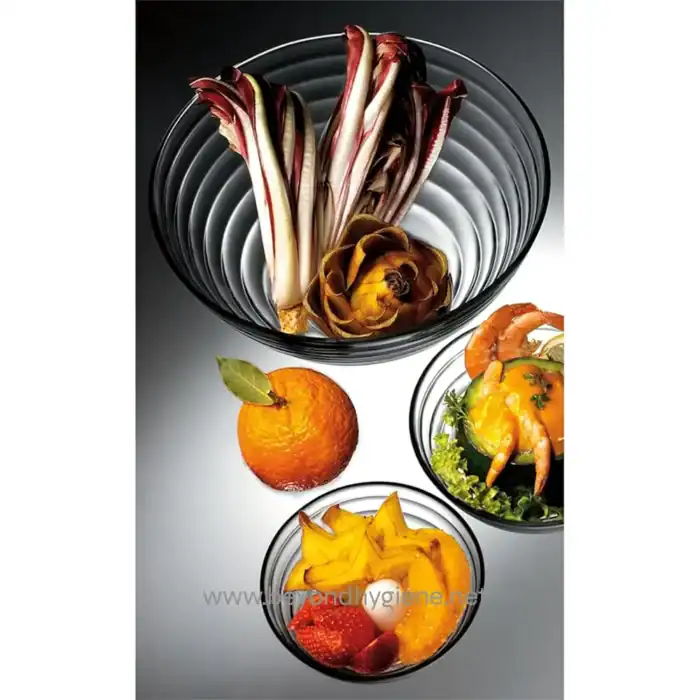 Fresh edible art featuring radicchio, artichoke, citrus, shrimp, and tropical fruit arranged in elegant glass bowls for upscale dining or healthy eating presentations.