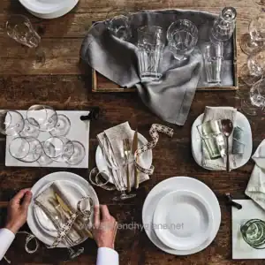 Crystal glassware set for dining table with linen napkins and gold cutlery, elegant table setting for special occasions, beyond hygiene asia cleaning and sanitization services in Asia.