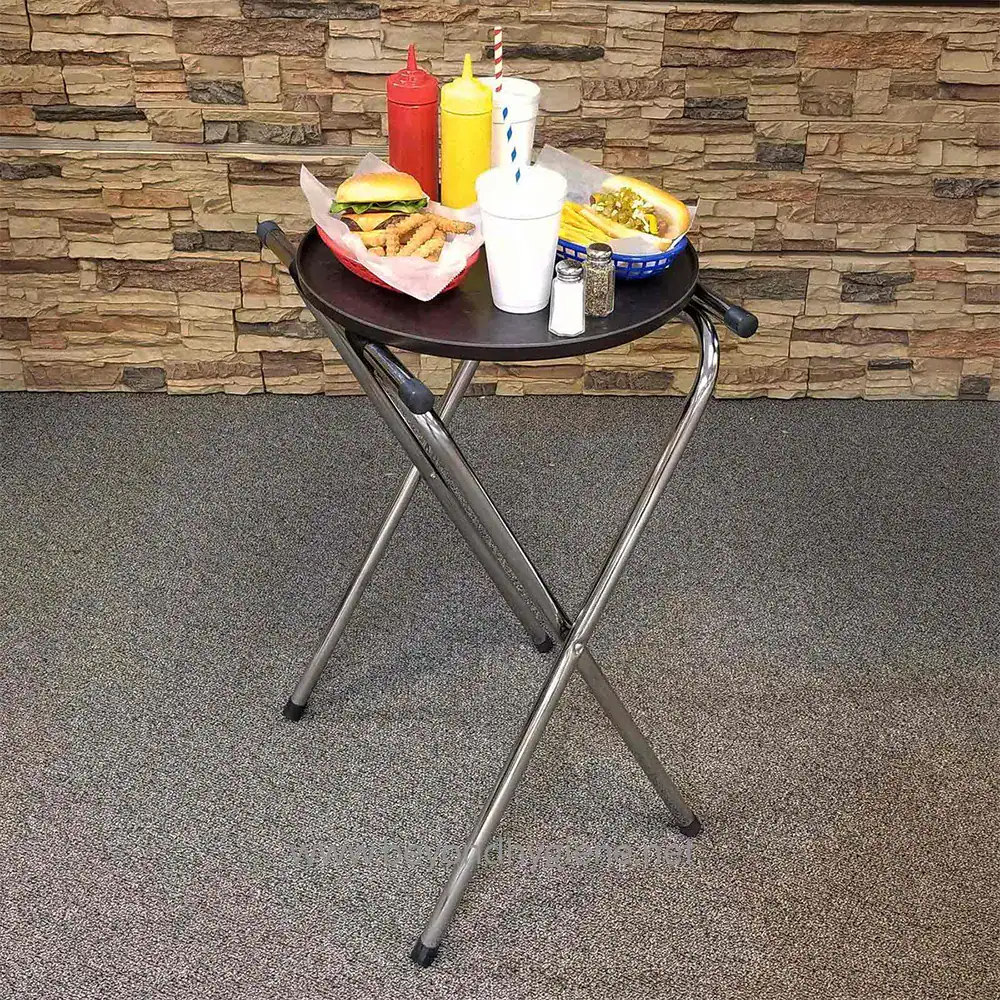 9 Plastic tray with condiments, ketchup, mustard, and pepper, along with fast food items like fries, burger, and hot dog on a black round table in a casual dining setting.