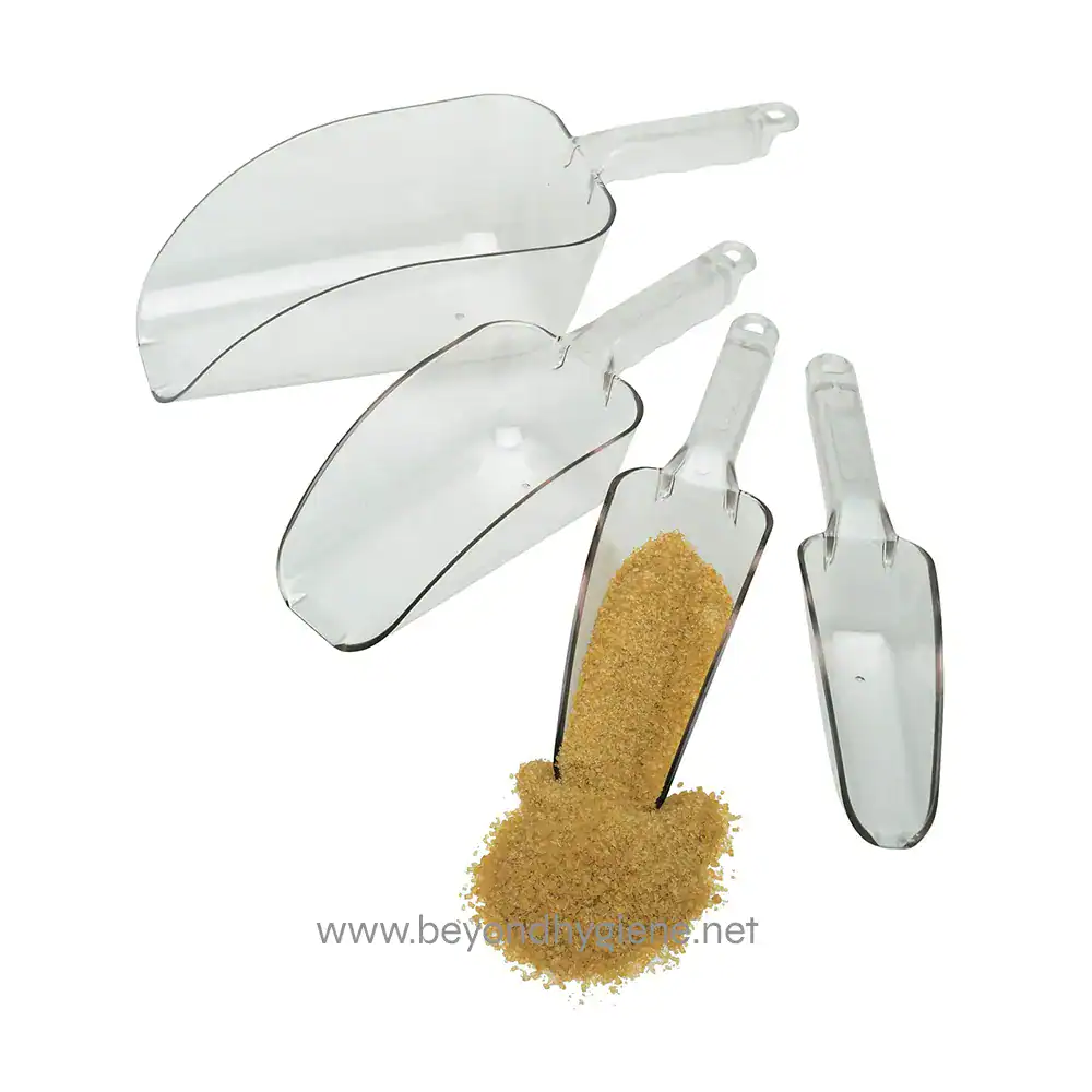 Camwear_Scoops_in_a_Row Disposable plastic spatulas for hygiene and food safety, displayed with brown sugar, used for precise ingredient portions, emphasizing hygiene practices in Asian food industries.