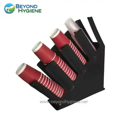 Disposable red coffee cups with lids in a black holder, ideal for office or event beverage service. Perfect for hygienic handling and easy organization in commercial and hospitality settings.