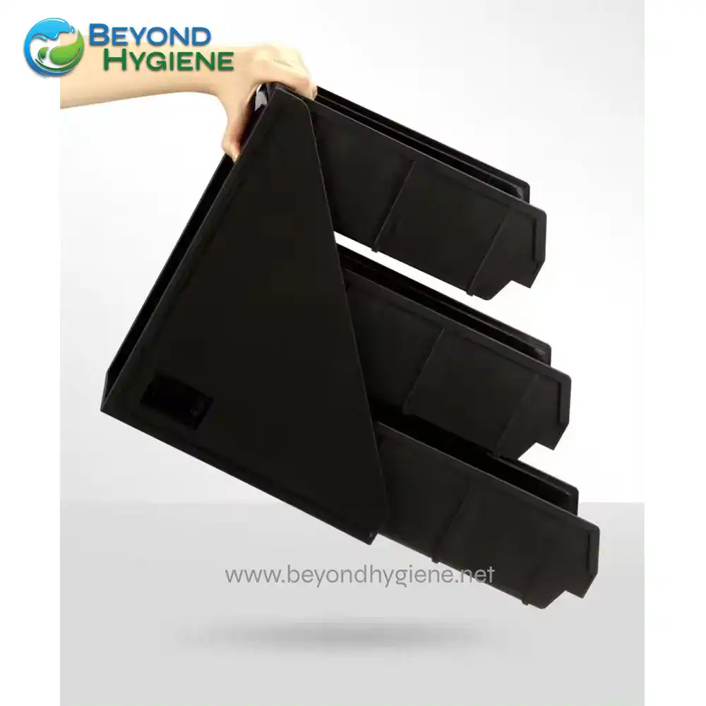 UGA-JD86258C_3 Black plastic injection mold tool for hygiene equipment manufacturing.