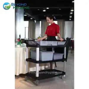 Flexible hotel service trolley for cleaning and guest amenities, modern hospitality equipment, clean and organized, stainless steel and plastic cart, hospitality industry tools, Beyond Hygiene Asia.