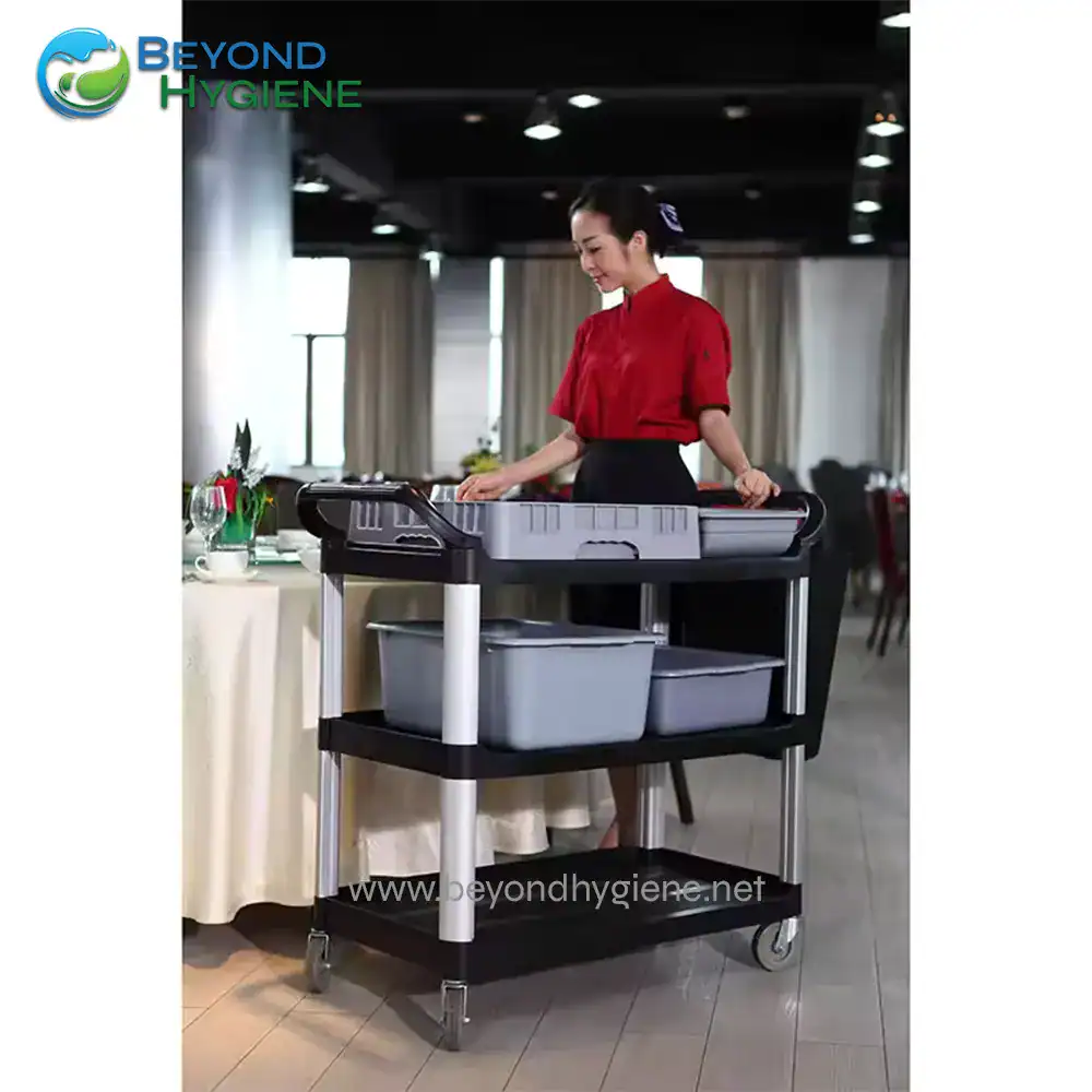 UGA-JDUC340B-2 Flexible hotel service trolley for cleaning and guest amenities, modern hospitality equipment, clean and organized, stainless steel and plastic cart, hospitality industry tools, Beyond Hygiene Asia.