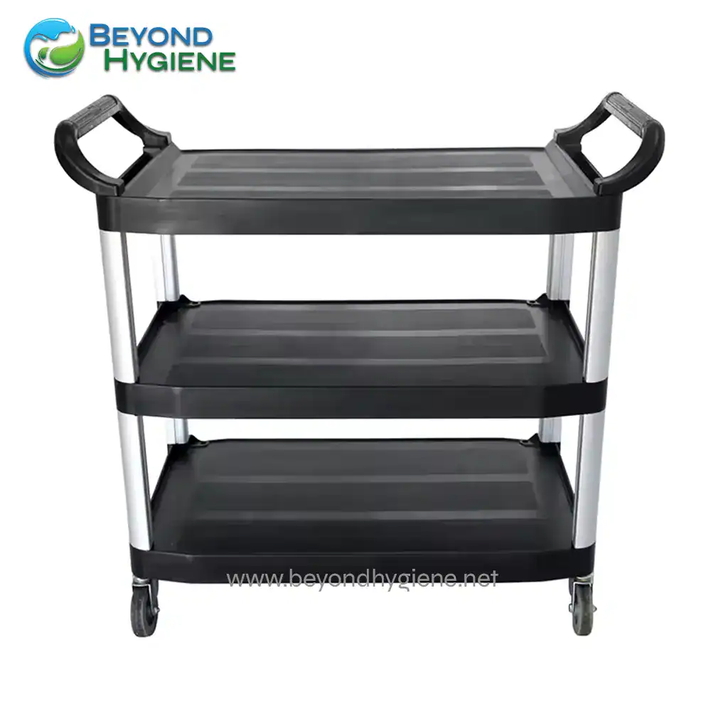 UGA-JDUC340B-3 Stainless steel three-tier utility cart with black shelves and caster wheels, ideal for sanitation and cleaning purposes in Asian hygiene facilities.