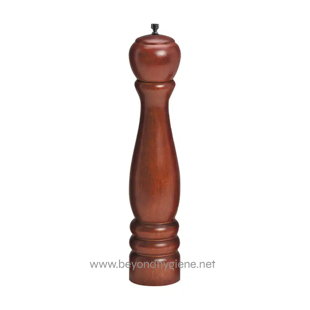 Black pepper grinder made of wood, used for seasoning dishes, in a professional kitchen or dining setting. High-quality kitchen accessory for culinary enthusiasts and chefs.