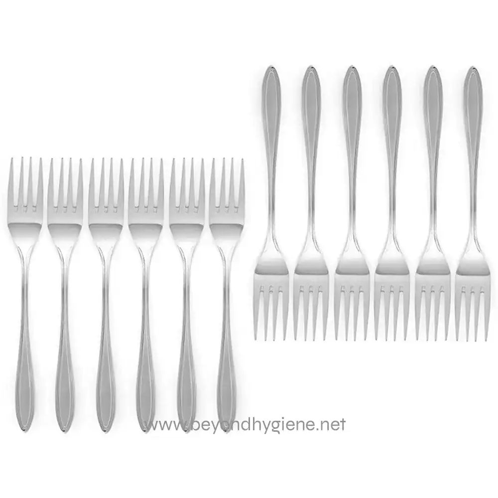 s-l1600 (1) Stainless steel forks arranged in two parallel rows on white background, used in commercial and hospitality dining settings for hygiene and durability.