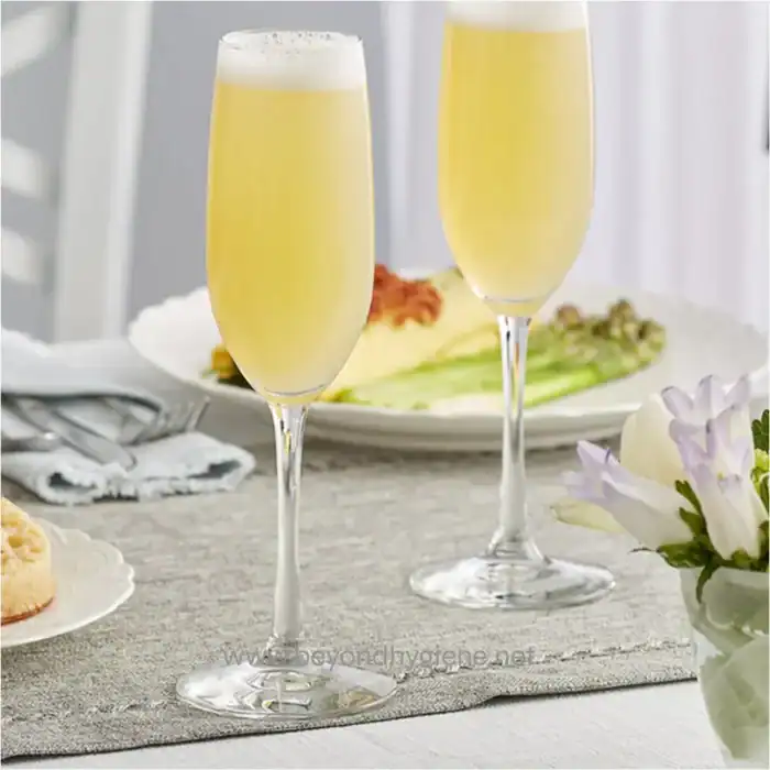 Champagne glasses with bubbly drink on dining table, clean sanitation, beyond hygiene asia, food service, beverage, hospitality, event catering, hygiene standards.