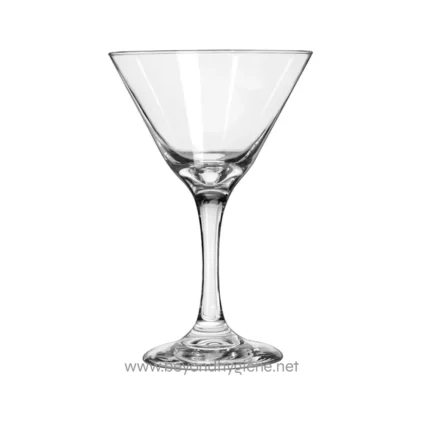 Clear martini glass for beverages with clean, minimalist background, symbolizing hygiene and cleanliness, ideal for representing sanitation standards.