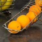 Tablecraft FC1649 Chrome Curved Fruit Basket - 14 1/2" x 18"