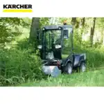 Karcher compact street sweeper cleaning a park area amidst trees and greenery.