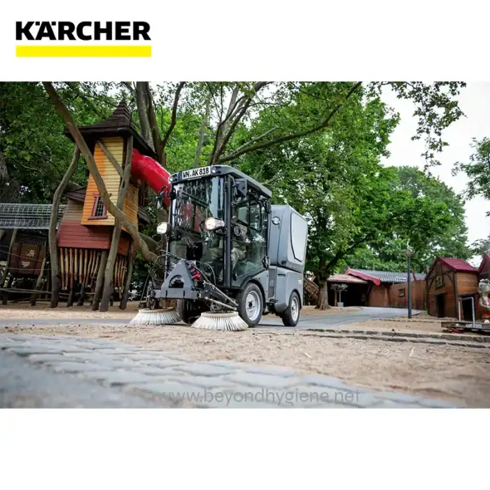 Kärcher street cleaning machine at an outdoor playground cleaning dirt and debris, showcasing eco-friendly outdoor hygiene services.