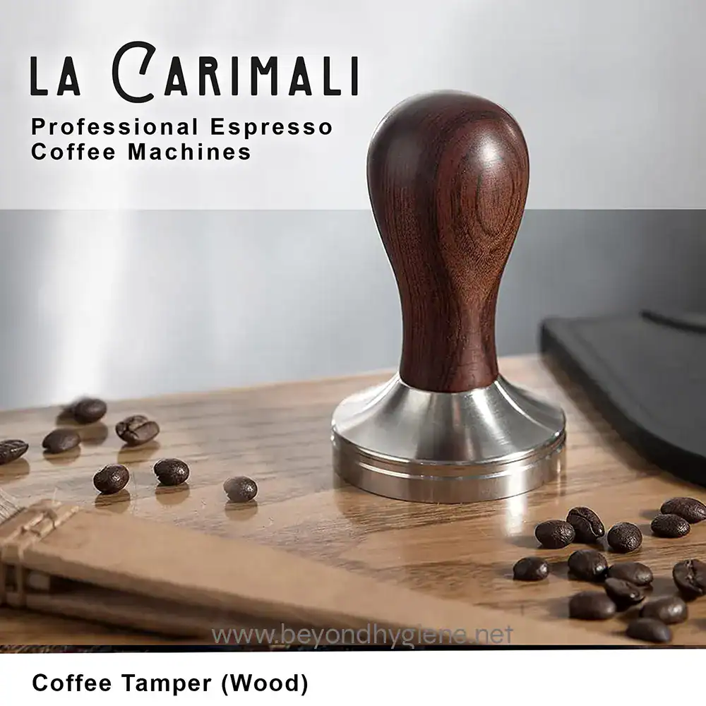 Coffee Tamper (Wood) (3) Coffee tamper with wooden handle for professional espresso coffee machines, placed on a wooden surface with scattered coffee beans.
