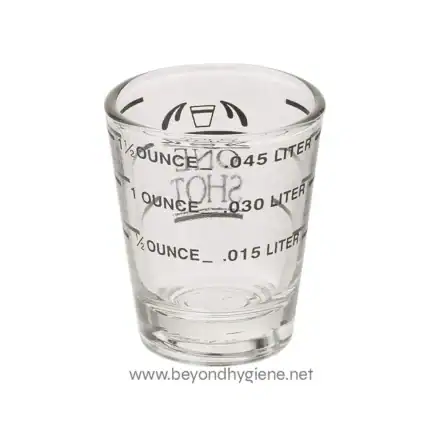 Measurement glass for liquids, featuring iconic graduation markings for ounces and liters, ideal for scientific or laboratory use.