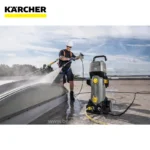 Karcher roof cleaning equipment, technician cleaning roof surface with high-pressure washer, industrial cleaning on rooftop, waterproofing and maintenance, outdoor commercial roof cleaning services, beyond hygiene asia.