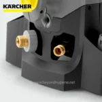 Karcher cleaning equipment part with brass fittings and black plastic housing on white background.