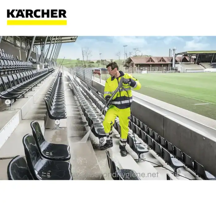 Disinfecting stadium seating with high-pressure sprayer for thorough sanitization and hygiene maintenance.