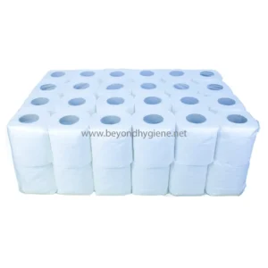 White industrial toilet paper rolls stacked neatly for hygiene and sanitation needs.