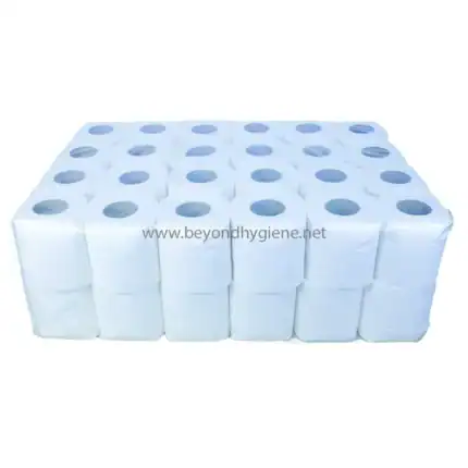 White industrial toilet paper rolls stacked neatly for hygiene and sanitation needs.