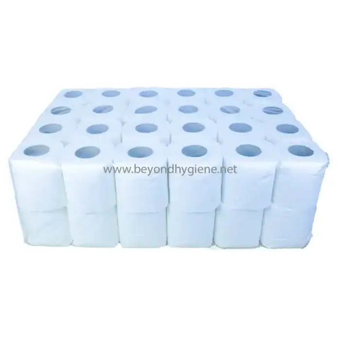White industrial toilet paper rolls stacked neatly for hygiene and sanitation needs.