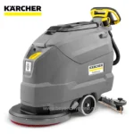 Karcher professional floor cleaning machine, industrial-grade floor sweeper with water spray for commercial cleaning, ideal for large facility sanitation.