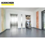 Karcher cleaning equipment in a modern commercial building hallway, focusing on hygiene and cleanliness solutions for healthcare, hospitality, and facility management industries.