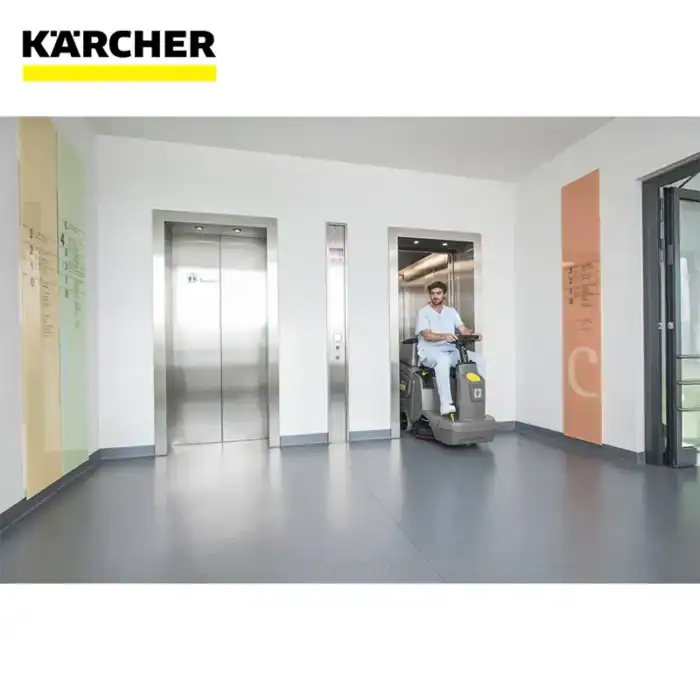 Karcher cleaning equipment in a modern commercial building hallway, focusing on hygiene and cleanliness solutions for healthcare, hospitality, and facility management industries.