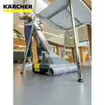 Kärcher floor cleaning machine using microfiber roller, ideal for commercial and industrial hygiene solutions, promoting cleanliness and sanitation.