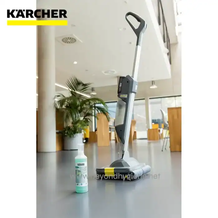 Kärcher floor cleaning machine with disinfectant in modern commercial space, industrial-grade hygiene equipment, cleaning technology for hygiene and sanitation, Beyond Hygiene Asia logo visible, emphasizing cleaning solutions.