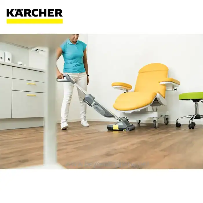 Deep cleaning of medical chair using industrial vacuum cleaner at healthcare facility in Singapore, professional hygiene and sterilization services by Beyond Hygiene Asia.