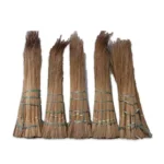 Broom sticks made of natural bamboo or rattan, bundled and secured, used for cleaning in Asian households, sustainable cleaning tools, eco-friendly sweeping equipment.