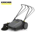 Kärcher floor cleaning machine with sweeping brush and large wheels, ideal for commercial and industrial cleaning applications.
