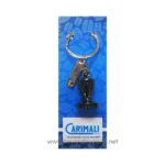 Steel keychain with Carimali coffee machine logo, attached to a blue cardboard with bakery ingredients pattern, promoting coffee equipment and accessories for commercial use.
