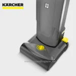 Karcher industrial cleaning machine on gray background.
