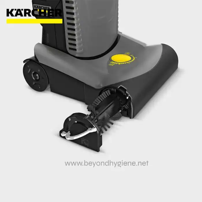 Kärcher floor scrubber in gray and black with yellow control dial, designed for commercial cleaning.